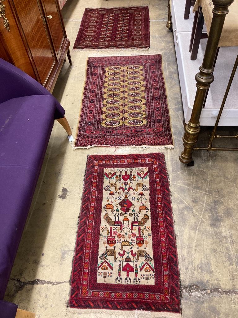 Two Bokhara rugs and a Turkish mat, largest 130 x 76cm